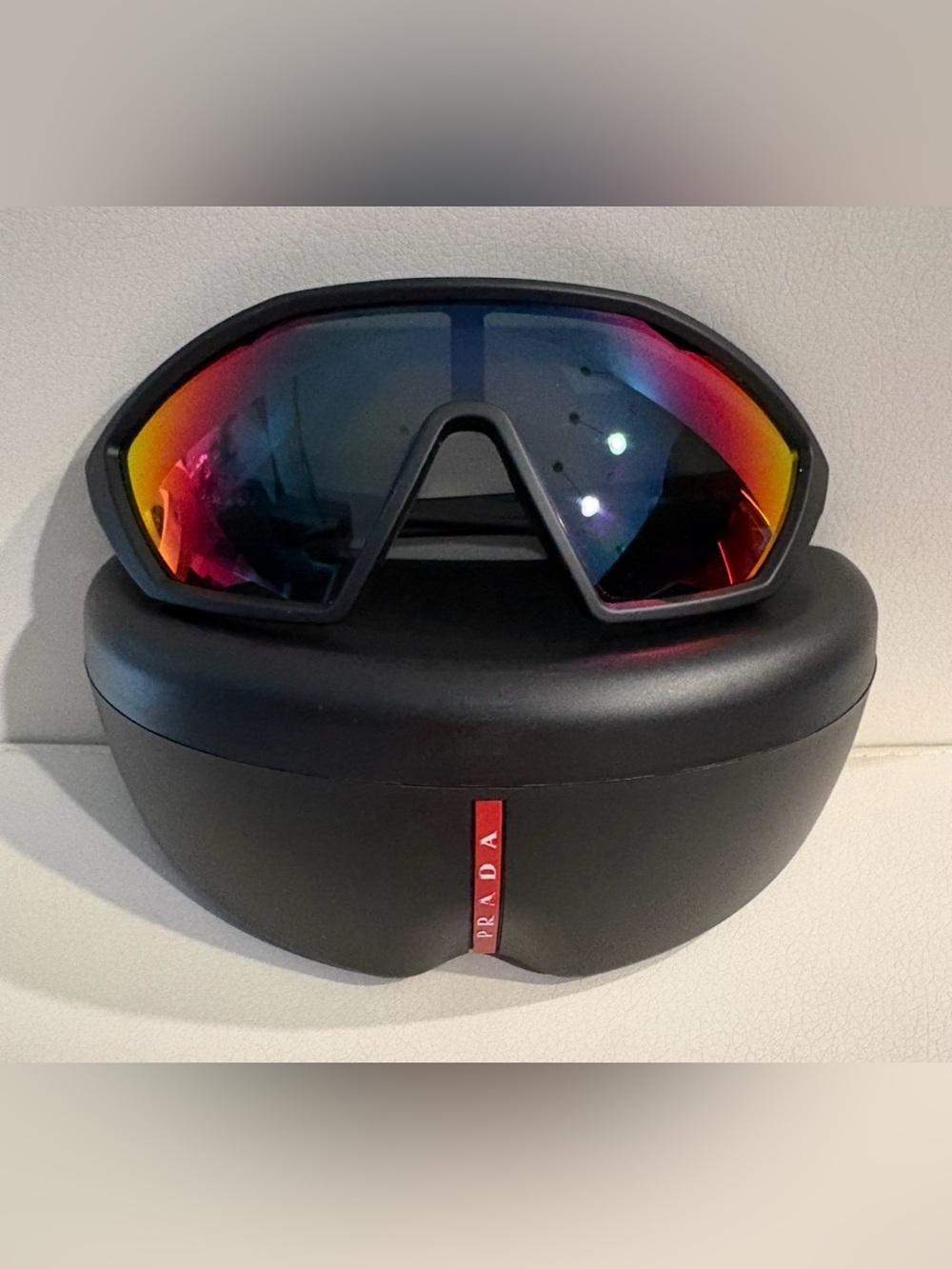 Prada Linea Rossa Sunglasses feature a black rubber frame (multicolored)
